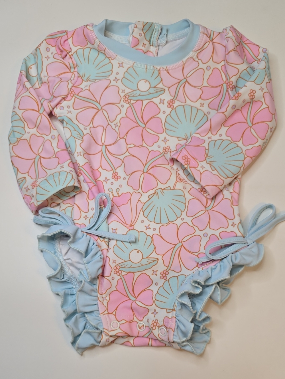 Caden Lane Rashguard Ruffle Botton Swimsuit - Pink & Light Blue Seashell Print
